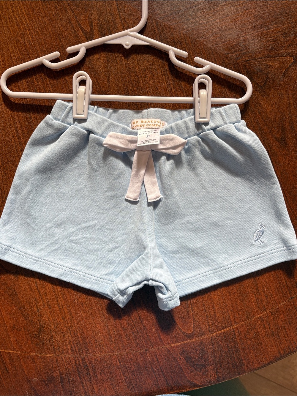 The Beaufort Bonnet Company Baby Blue Knit Shorts with white bow